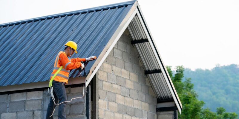 Roofer repairing roof