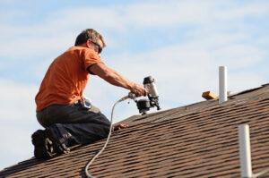 roofing expert working on maintenance and repairs of residential roof